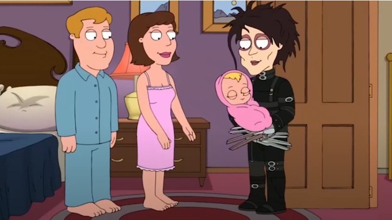 Edward Scissorhands holding baby