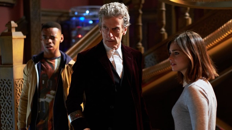 Joivan Wade, Peter Capaldi, and Jenna Coleman standing together