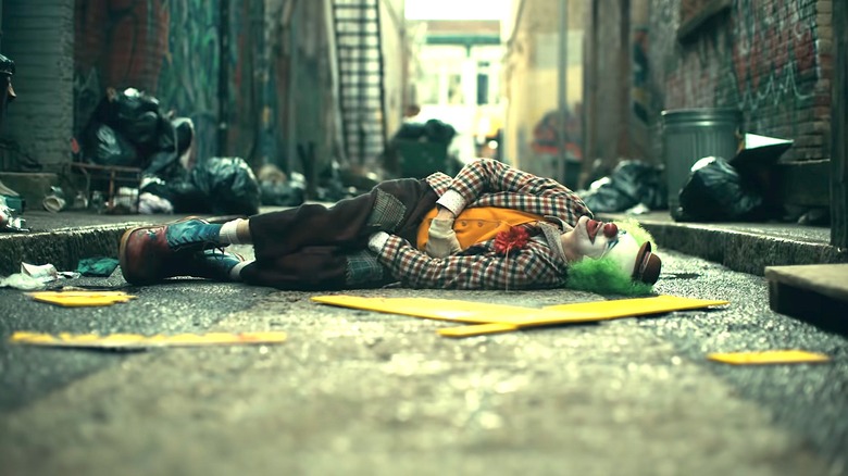 Joker laying in gutter