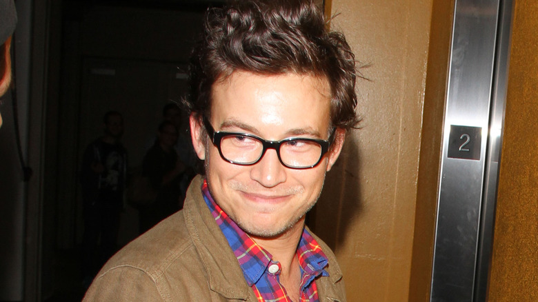 Jonathan Taylor Thomas smiling near elevator