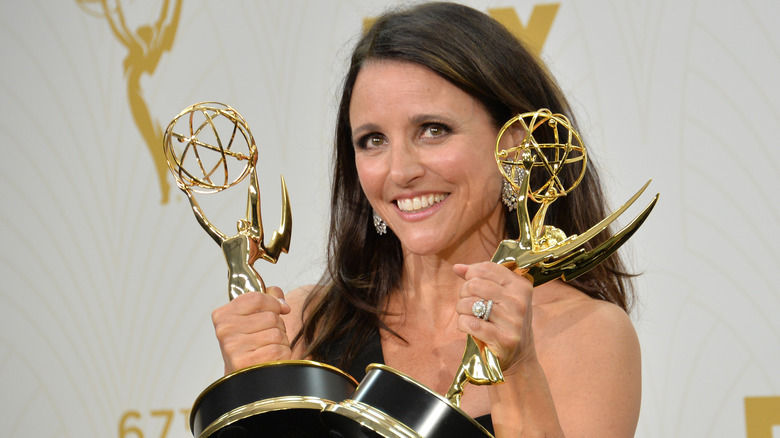 Julia Louis-Dreyfus holding two Emmys