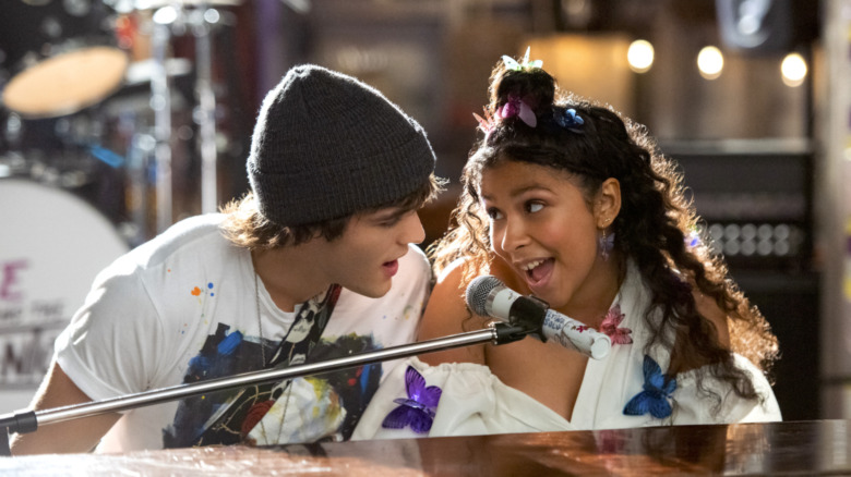 Luke and Julie playing piano and singing