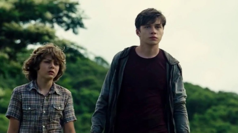 Nick Robinson and Ty Simpkins watching out for dinosaurs