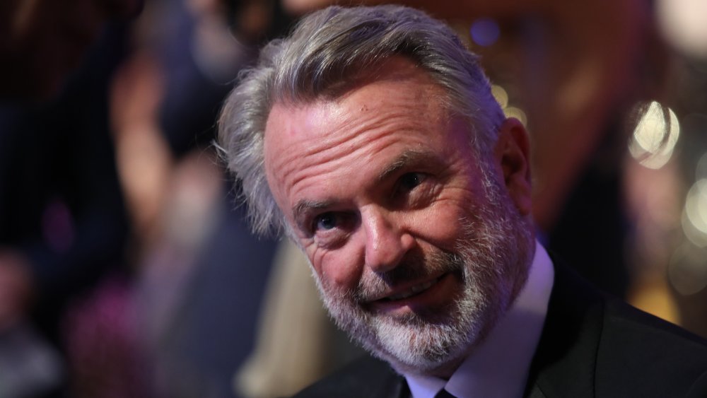 Sam Neill smiles