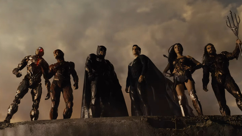 Members of the Justice League are standing side by side