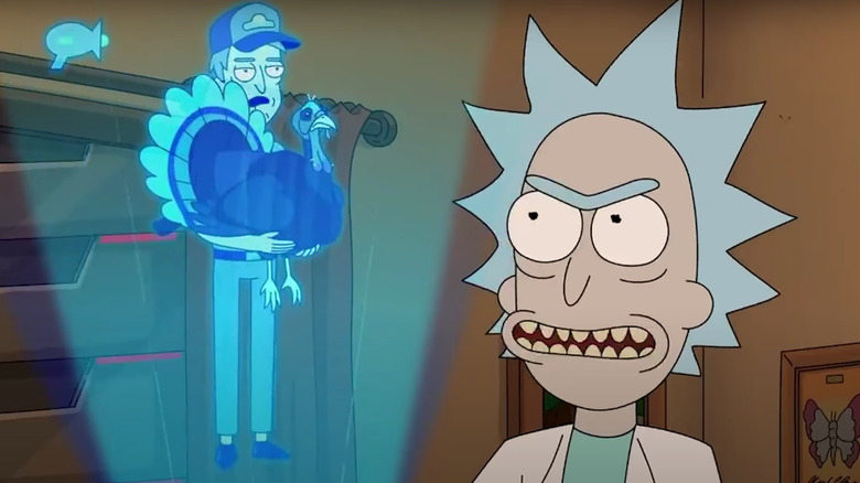 Rick stares at a hologram