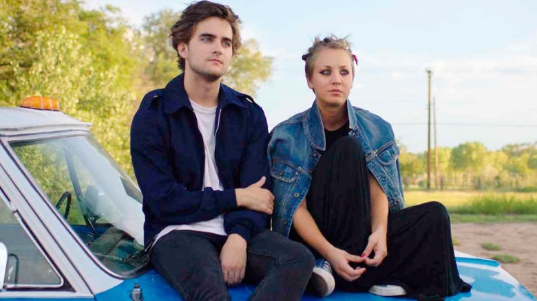 Dylan and Katy sitting on a car