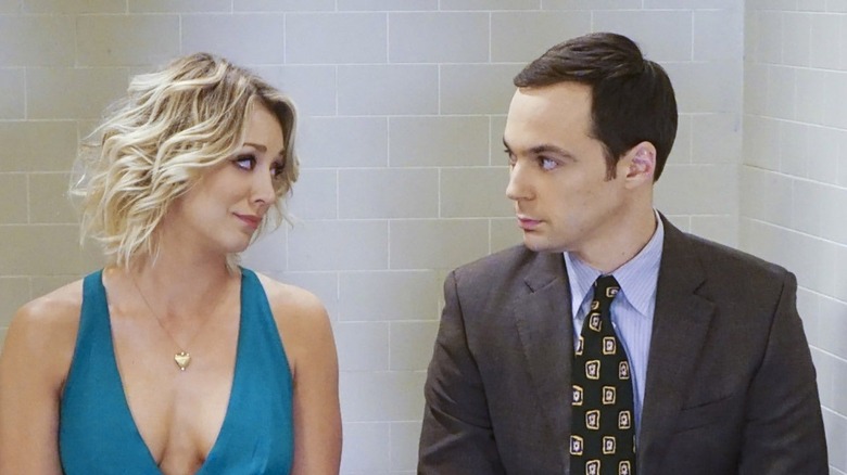 Penny and Sheldon talking in a bathroom