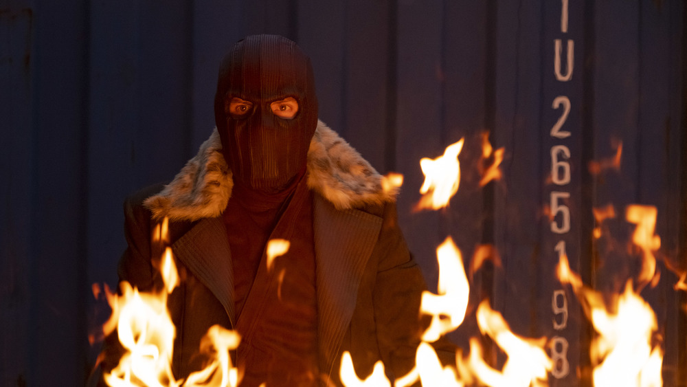 Masked Zemo near fire