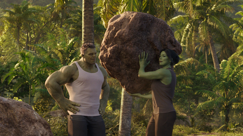 She-Hulk throwing boulder with Hulk