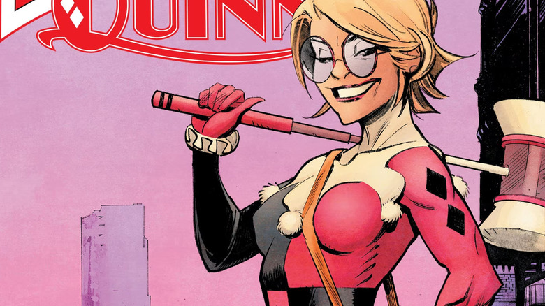 Harley Quinn smiling holding a mallett