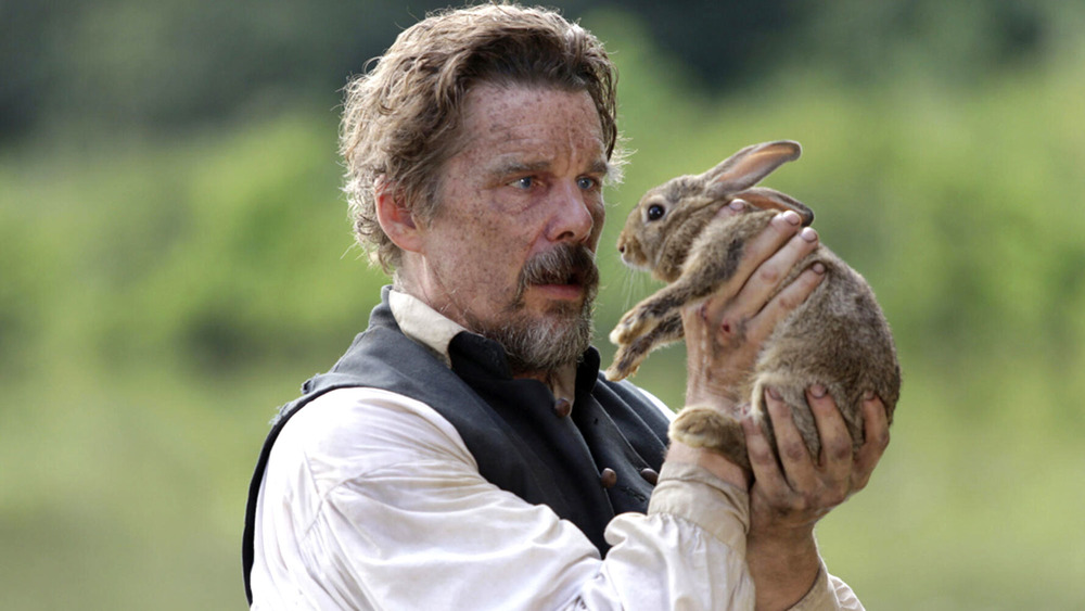 Ethan Hawke as John Brown holding a rabbit in Good Lord Bird