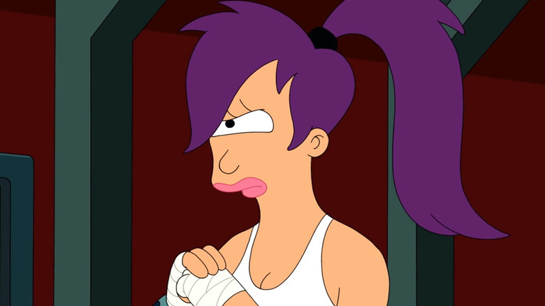 Leela clenching her fists together