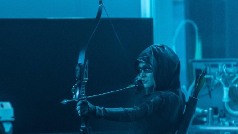 Mia wielding bow and arrow