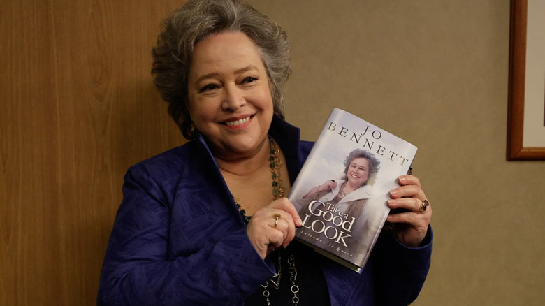 Jo Bennett holding her book 