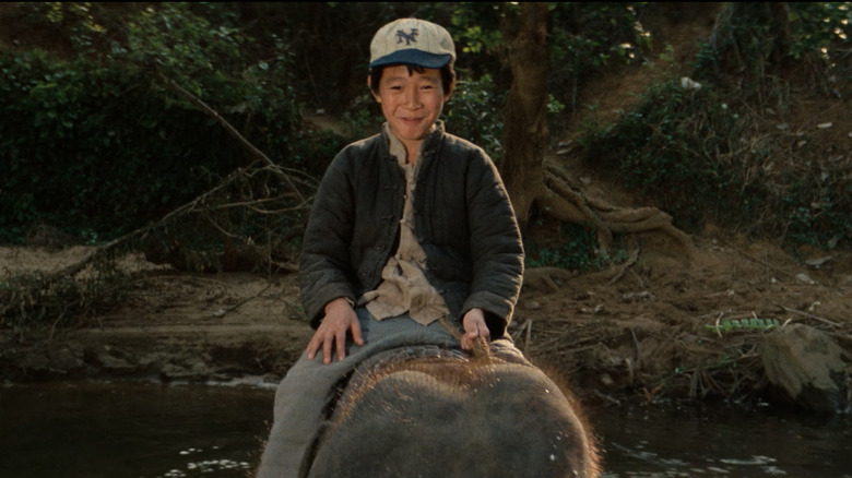 Short Round riding a small elephant in Temple of Doom