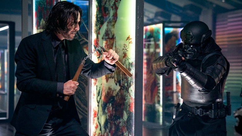 John Wick fighting guy with nunchucks