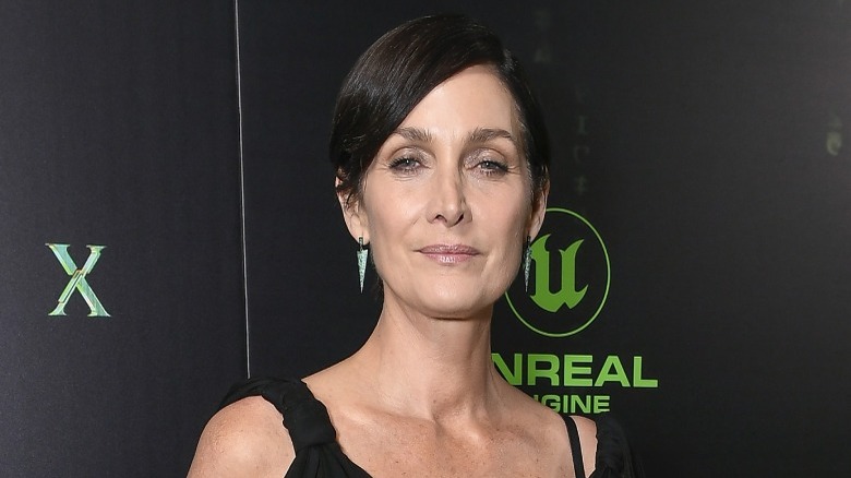 Carrie-Anne Moss posing