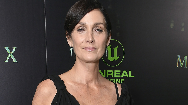 Carrie-Anne Moss smiling