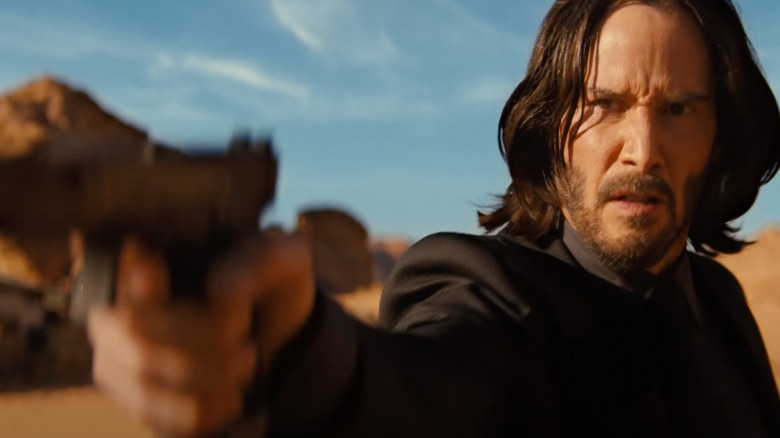 John Wick holding a gun