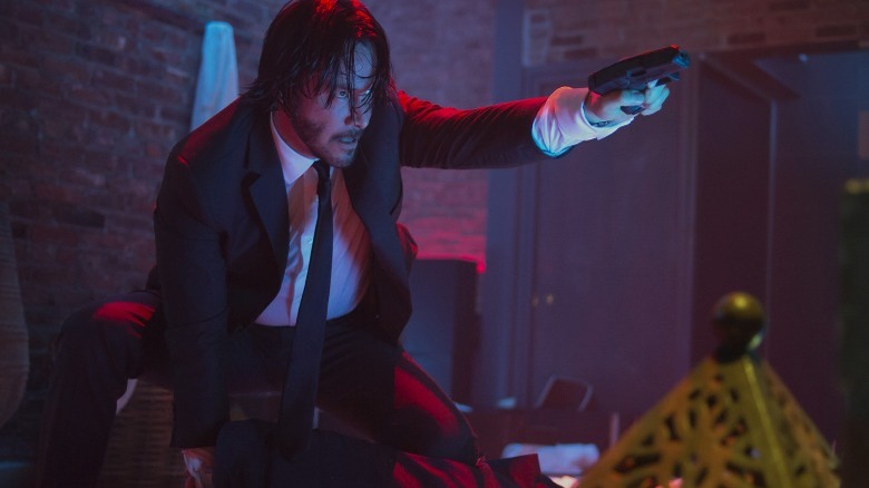 John Wick holding a gun