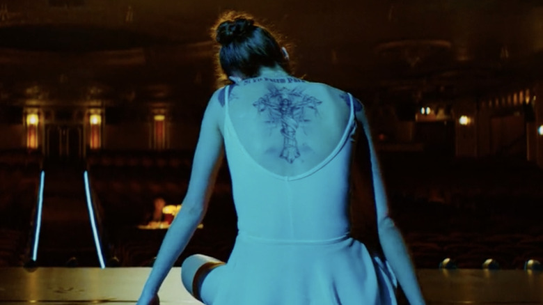 Ballerina wearing a leotard with a back tattoo