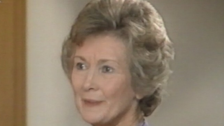 Dinah Sheridan listens intently