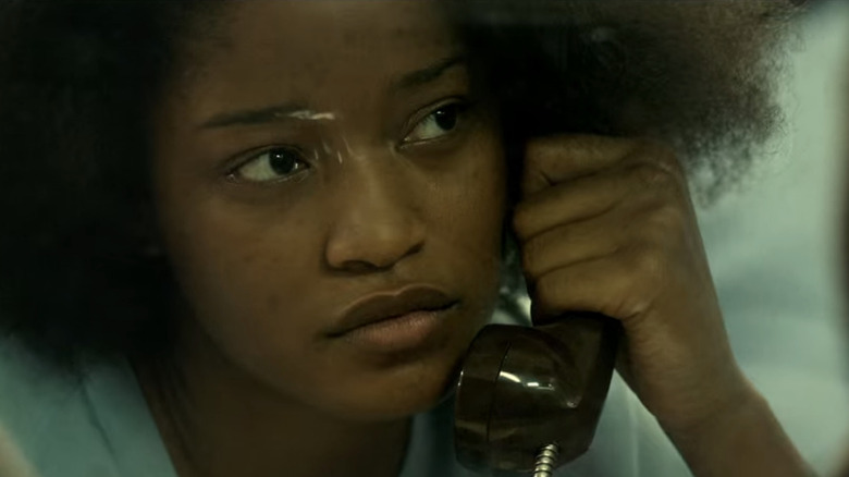 Keke Palmer holds a phone receiver