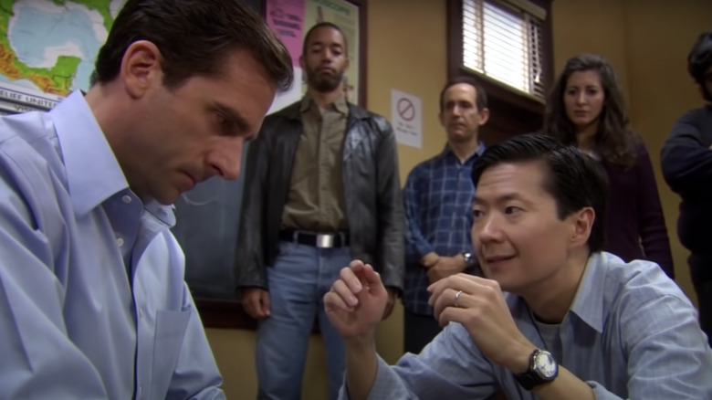 Steve Carell and Ken Jeong talking in The Office