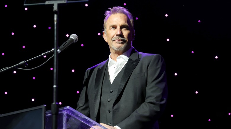 Kevin Costner speaking on stage