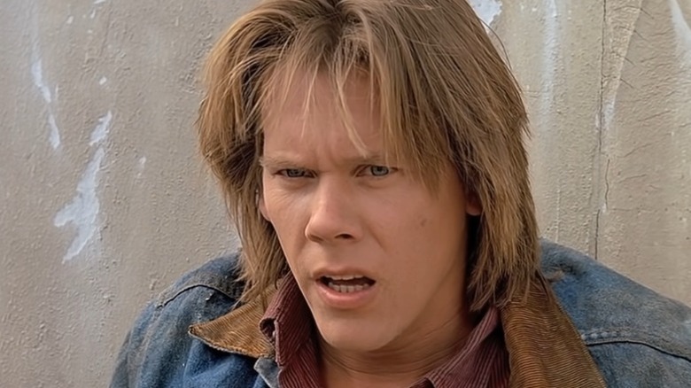 Kevin Bacon as Val in Tremors