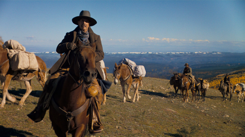 Kevin Costner smiling on horse