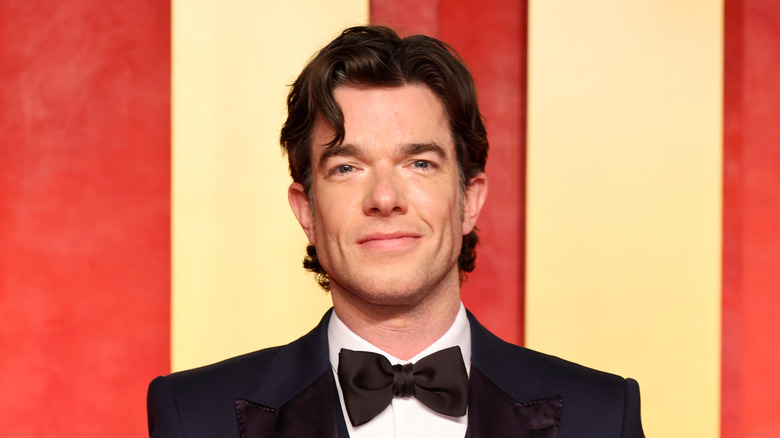 John Mulaney posing for photos