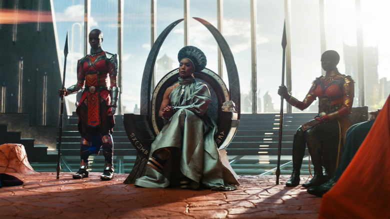 Queen Ramonda sitting in Wakanda's throne room