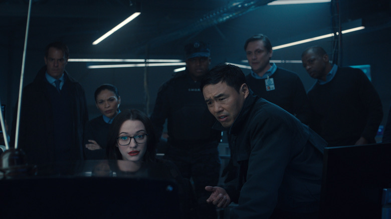 Jimmy Woo, Darcy Lewis, and SWORD agents looking at a monitor