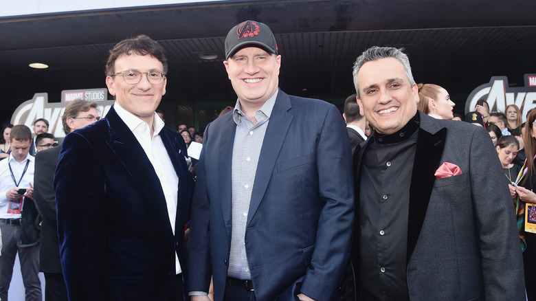 Kevin Feige posing with Russo brothers