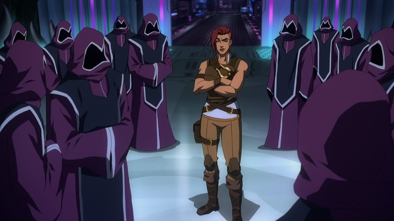 Teela surrounded by hooded figures