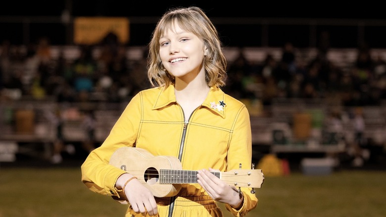 Susan "Stargirl" Caraway playing her ukulele on the field (2020)