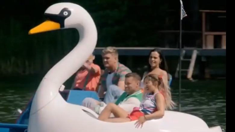 Campers riding a giant swan 