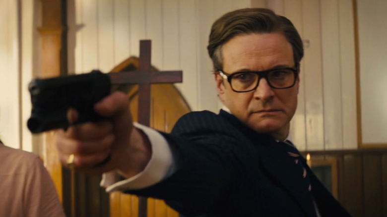 Colin Firth aims gun