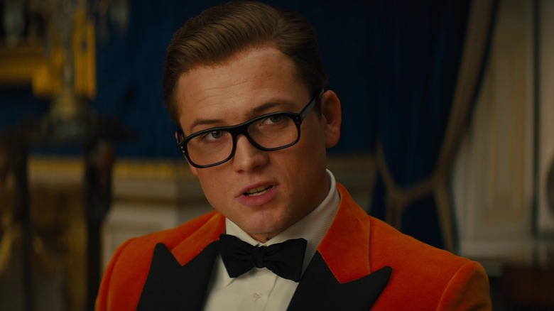 Eggsy wearing orange suit