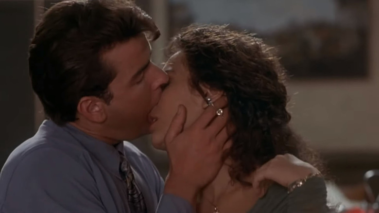 Charlie Sheen kissing Valeria Golino's nose