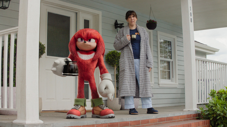 Knuckles and Wanda standing on porch