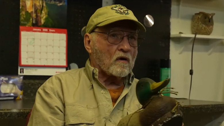 Robert Legg holding decoy duck 