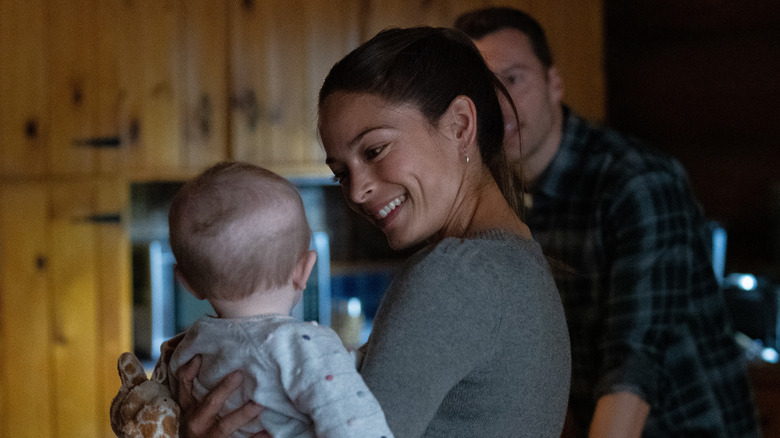 Joanna smiling at baby Burden of Truth