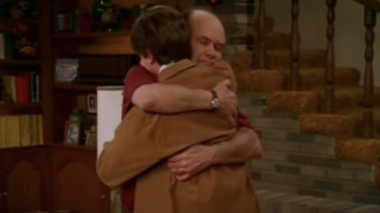 Red Forman hugging Eric