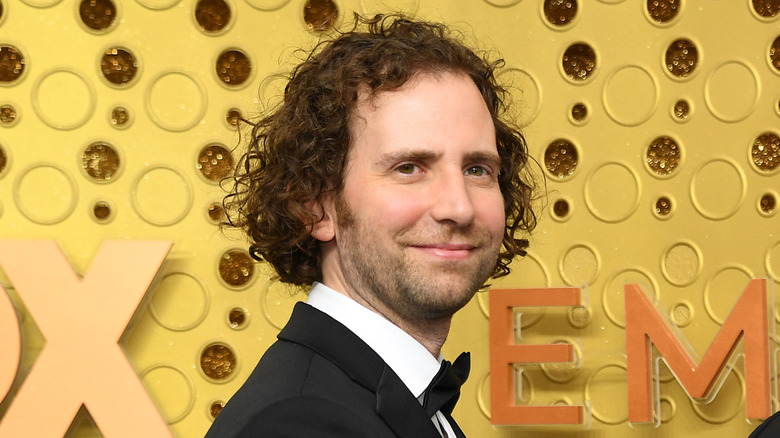 Kyle Mooney standing half-turned