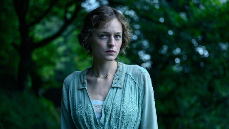 Emma Corrin as Lady Chatterley in the forest