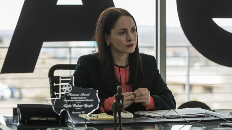 Lydia sitting behind a desk