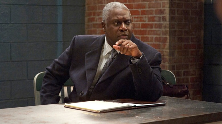 Bayard Ellis sits behind a desk on "Law & Order: SVU"